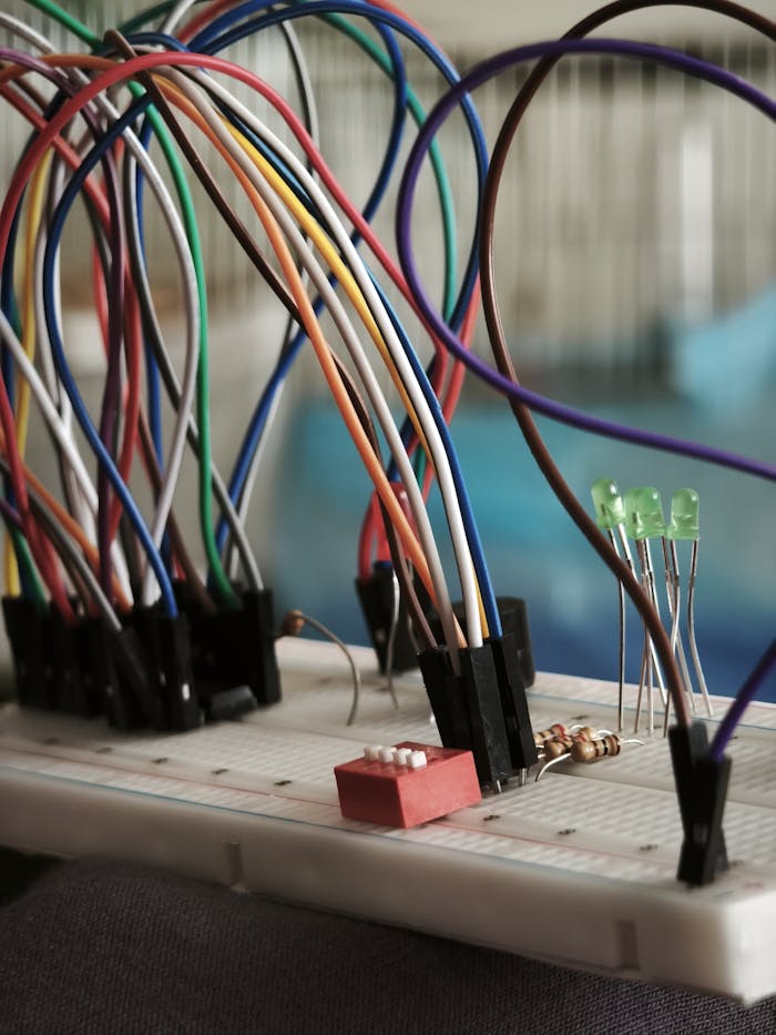 The Art of Drawing Readers In: Your attractive post title goes here A detailed view of a breadboard setup with multicolored wires and components.